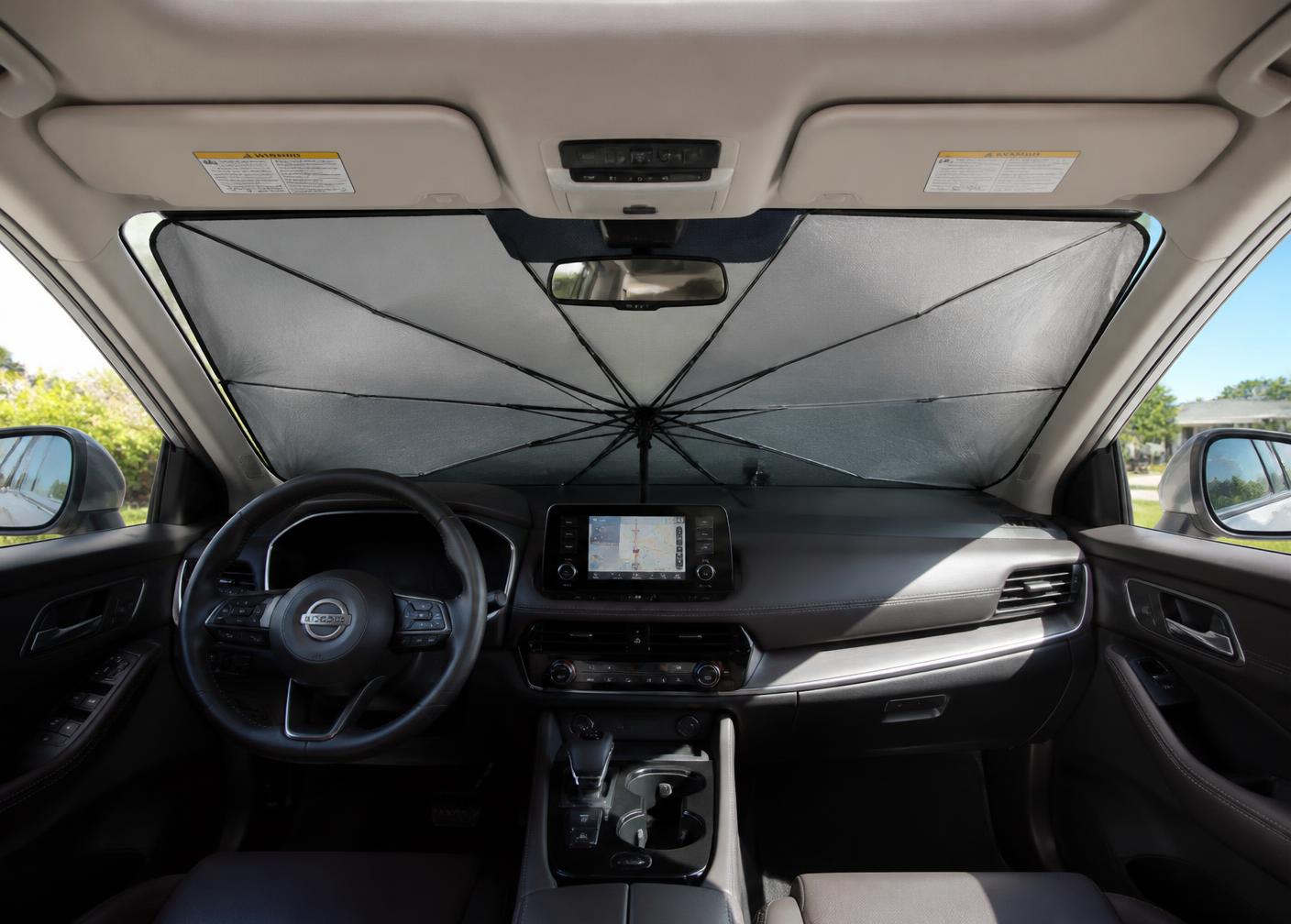 Car windshield sunshade opened inside a car windshield